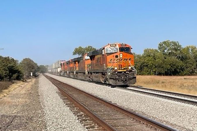 A high-priority westbound train was first to move over the 12-mile double-track cutover in October. 