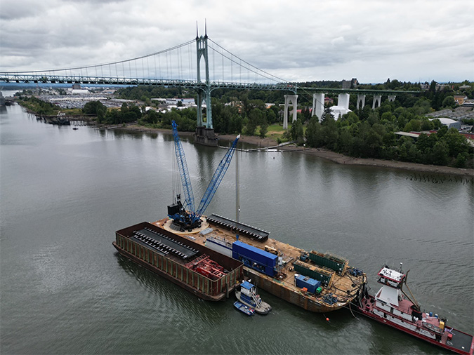 The last of the seven new bridges for the Fallbridge Subdivision replacement project is delivered on the Columbia River.  