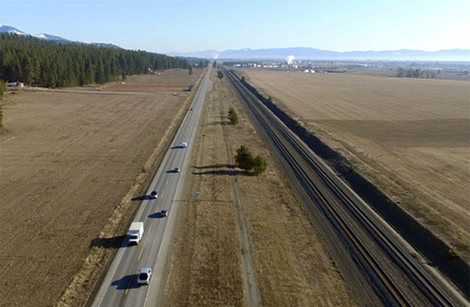 Highway 53 runs parallel to BNSF track near Hauser, Idaho.